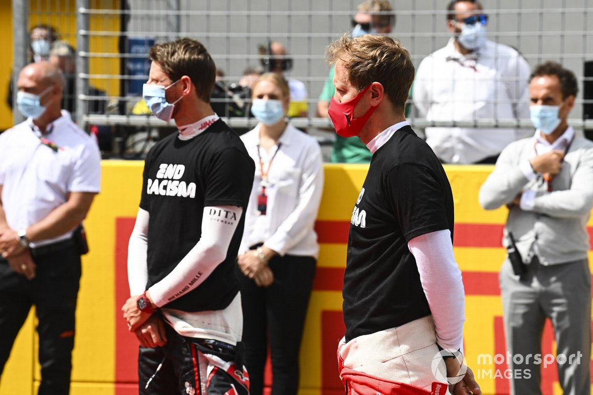 Romain Grosjean, Haas F1, and Sebastian Vettel, Ferrari, on the grid prior to the start