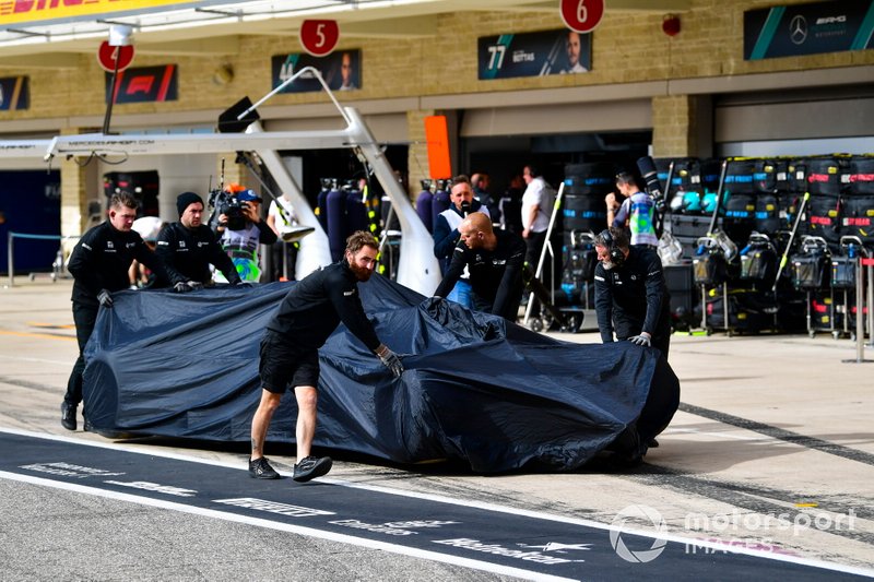 The car of Romain Grosjean, Haas F1 Team VF-19 is returned to the pit lane