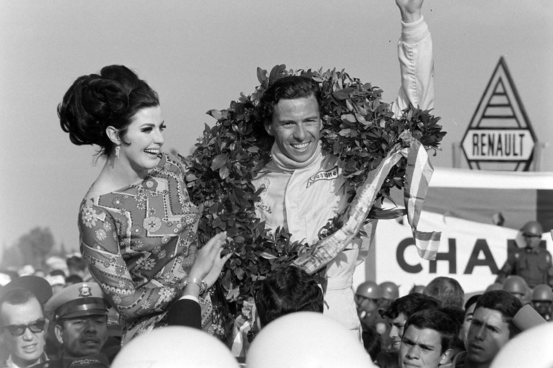 Jim Clark, Team Lotus celebrates victory on the podium

