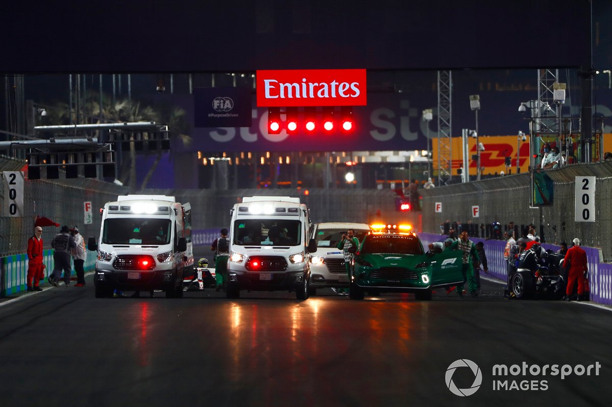 Medical personnel attend to Theo Pourchaire, ART Grand Prix and Enzo Fittipaldi, Charouz Racing System following a start line accident