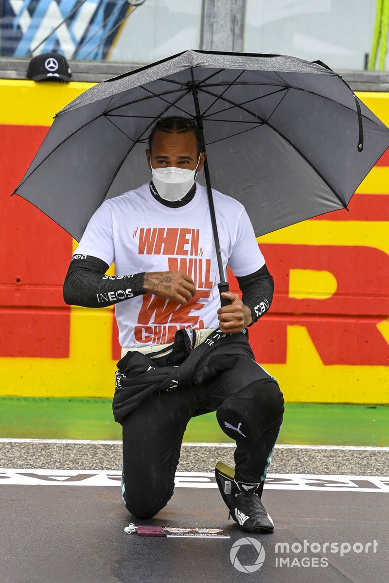 Lewis Hamilton, Mercedes, takes a knee on the grid