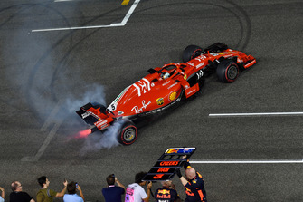 Sebastian Vettel, Ferrari SF71H donuts at the end of the race