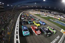 Drivers go four-wide to salute the fans before the start