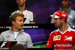 Nico Rosberg, Mercedes AMG F1 and Sebastian Vettel, Ferrari in the FIA Press Conference