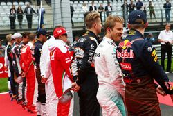 Nico Rosberg, Mercedes AMG F1 with Max Verstappen, Red Bull Racing as the grid observes the national