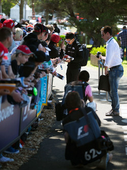 Rio Haryanto, Manor Racing signs autographs for the fans