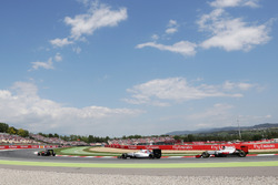 Fernando Alonso, McLaren MP4-31 leads Felipe Massa, Williams FW38 and Romain Grosjean, Haas F1 Team VF-16