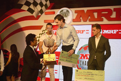 Sachin Tendulkar with MRF Challenge champion Harrison Newey, second place Joey Mawson, third place Mick Schumacher