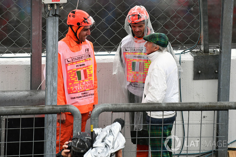 Jackie Stewart talks with marshals