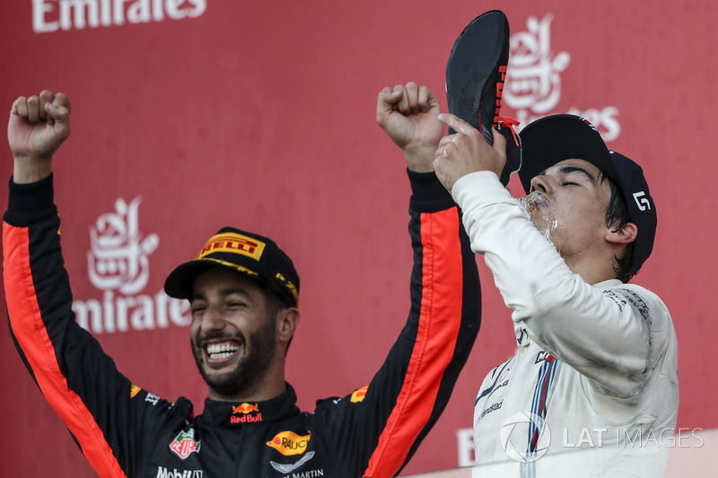 Lance Stroll, Williams celebrates on the podium, Daniel Ricciardo, Red Bull Racing and does a shoey, the champagne