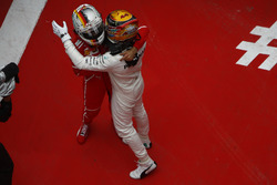 Lewis Hamilton, Mercedes AMG, and Sebastian Vettel, Ferrari, celebrate in parc ferme