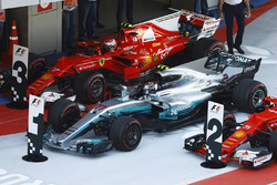 Race winner Valtteri Bottas, Mercedes AMG F1 W08, parks between Kimi Raikkonen, Ferrari SF70H and Sebastian Vettel, Ferrari SF70H