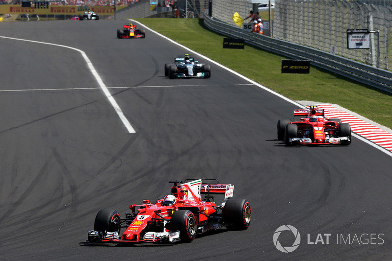 Sebastian Vettel, Ferrari SF70H, leads Kimi Raikkonen, Ferrari SF70H at the start of the race