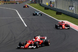 Sebastian Vettel, Ferrari SF70H, leads Kimi Raikkonen, Ferrari SF70H at the start of the race