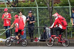 Ferrari fans on bikes