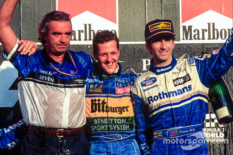 Podium: race winner and World Champion Michael Schumacher, Benetton celebrates with Flavio Briatore and third place Damon Hill