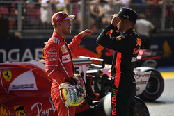 Pole sitter Sebastian Vettel, Ferrari and Daniel Ricciardo, Red Bull Racing in parc ferme