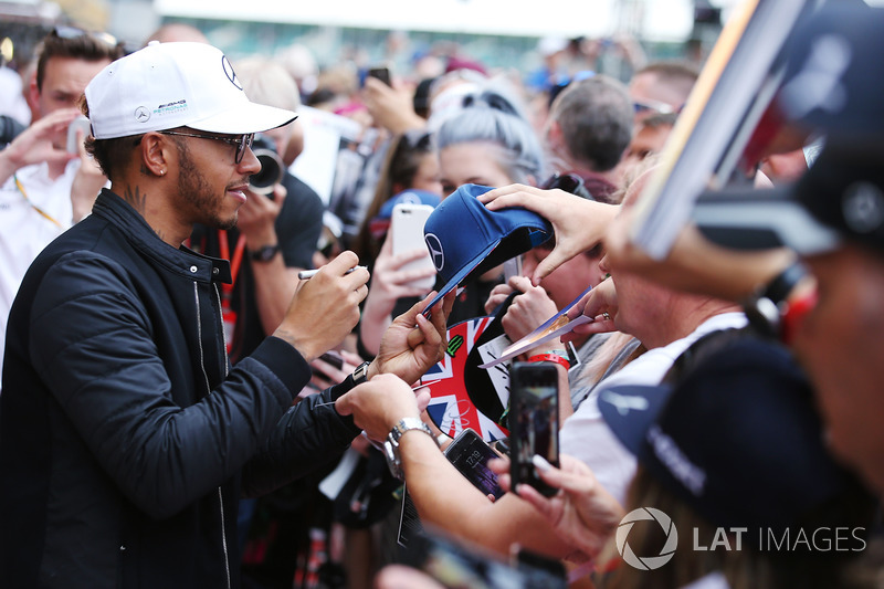 Lewis Hamilton, Mercedes AMG F1, signs autographs for fans