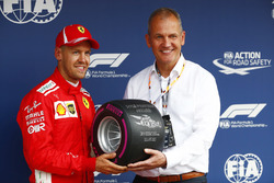 Sebastian Vettel, Ferrari, receives the Pirelli pole award