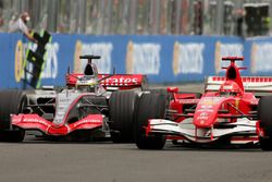 Pedro de la Rosa, McLaren Mercedes MP4-21 battles Michael Schumacher, Ferrari 248 F1