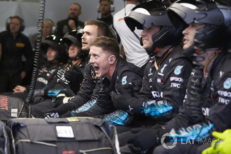 Mercedes pit crew cheer in the garage