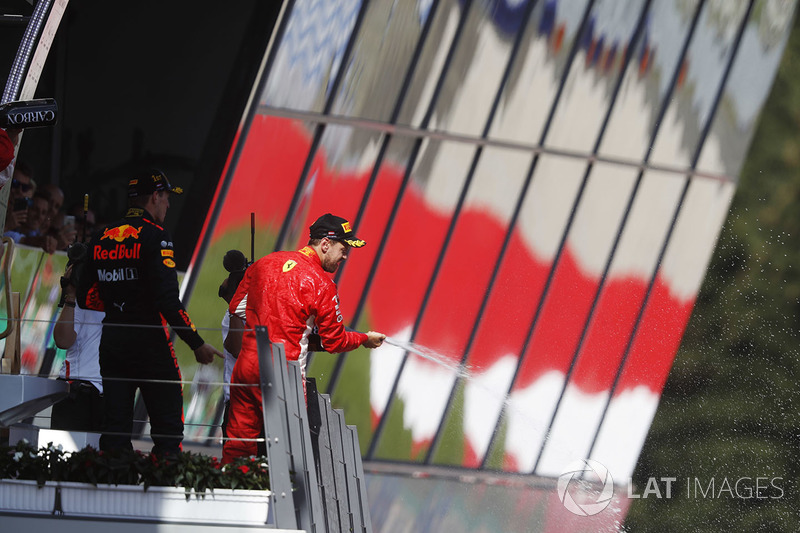Podium: third place Sebastian Vettel, Ferrari, sprays champagne on the podium, along with race winner Max Verstappen, Red Bull Racing