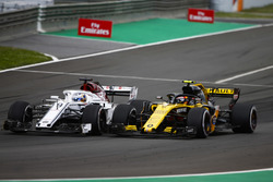 Marcus Ericsson, Sauber C37, battles Carlos Sainz Jr., Renault Sport F1 Team R.S. 18