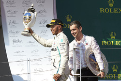 The Mercedes Constructors trophy delegate and Lewis Hamilton, Mercedes AMG F1, 1st position, on the podium
