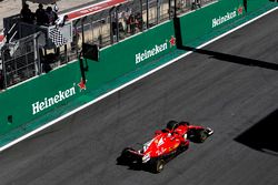 Sebastian Vettel, Ferrari SF70H crosses the line to take the chequered flag and win the race