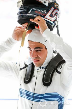 Lance Stroll, Williams Racing, puts his helmet on