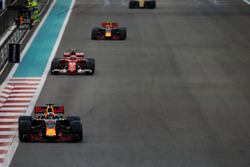 Daniel Ricciardo, Red Bull Racing RB13, leads Kimi Raikkonen, Ferrari SF70H, and Max Verstappen, Red Bull Racing RB13