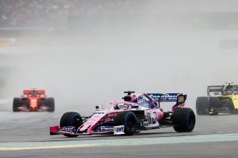 Sergio Perez, Racing Point RP19, leads Nico Hulkenberg, Renault F1 Team R.S. 19, and Sebastian Vettel, Ferrari SF90