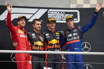 Sebastian Vettel, Ferrari, 2nd position, Guillaume Rocquelin, Head of Race Engineering, Red Bull Racing, Max Verstappen, Red Bull Racing, 1st position, and Daniil Kvyat, Toro Rosso, 3rd position, on the podium