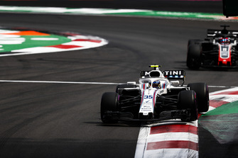 Sergey Sirotkin, Williams FW41, leads Romain Grosjean, Haas F1 Team VF-18