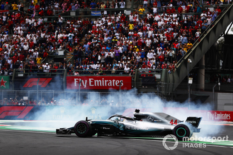 Lewis Hamilton, Mercedes AMG F1 W09 EQ Power+, performs a doughnut as he celebrates winning his fifth World Championship