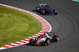 Romain Grosjean, Haas F1 Team VF-18, leads Pierre Gasly, Scuderia Toro Rosso STR13 