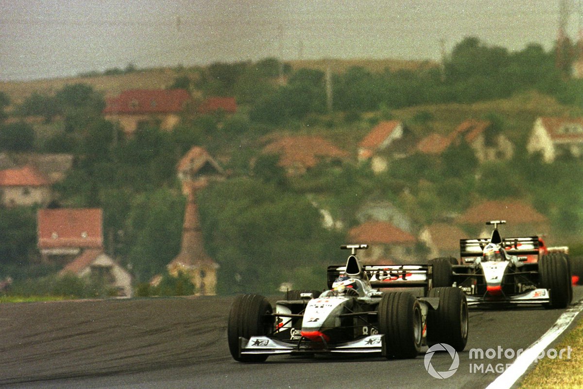 Mika Hakkinen, McLaren MP4/13 Mercedes-Benz leads David Coulthard, McLaren MP4/13 Mercedes-Benz