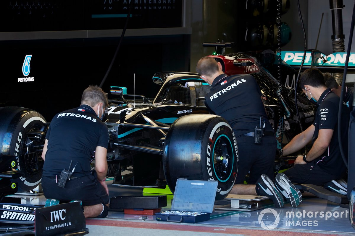 Mechanics work on the car of Lewis Hamilton, Mercedes F1 W11