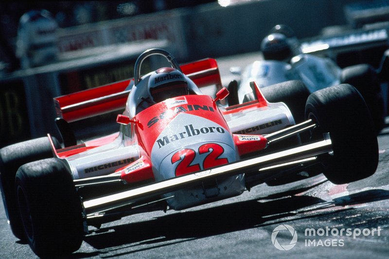 Mario Andretti, Alfa Romeo 179C, bounces over a kerb