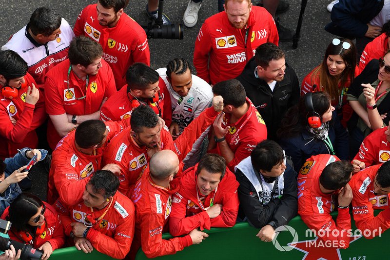 Lewis Hamilton, Mercedes AMG F1, 1st position, talks to Ferrari team personnel after the race