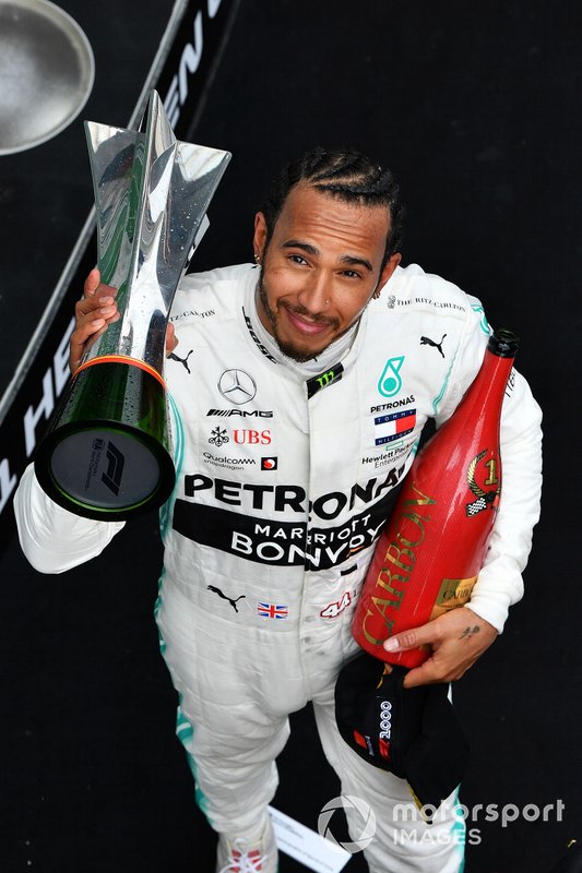 Lewis Hamilton, Mercedes AMG F1, 1st position, with his trophy and Champagne