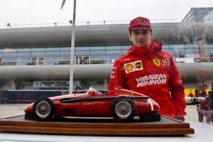 Charles Leclerc, Ferrari, admires a model Maserati 250F