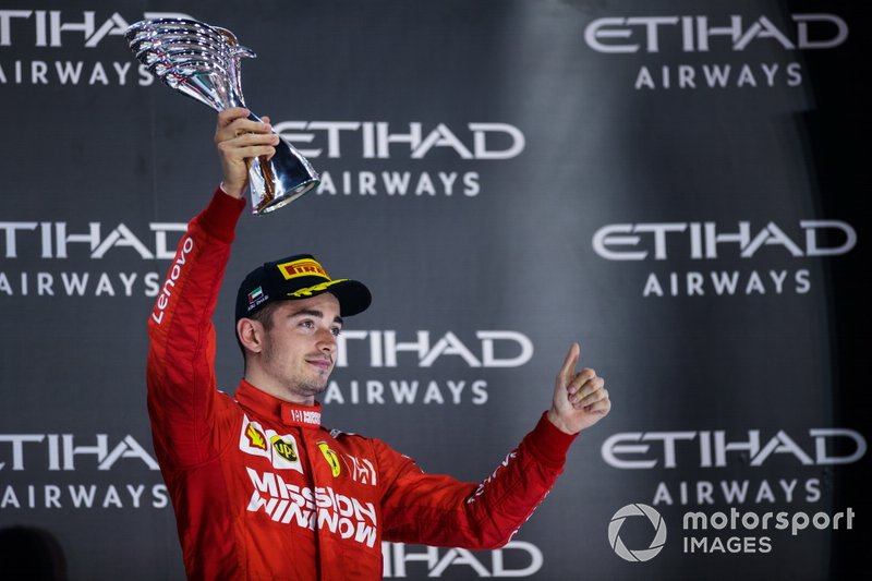Charles Leclerc, Ferrari, terzo classificato, sul podio con il trofeo