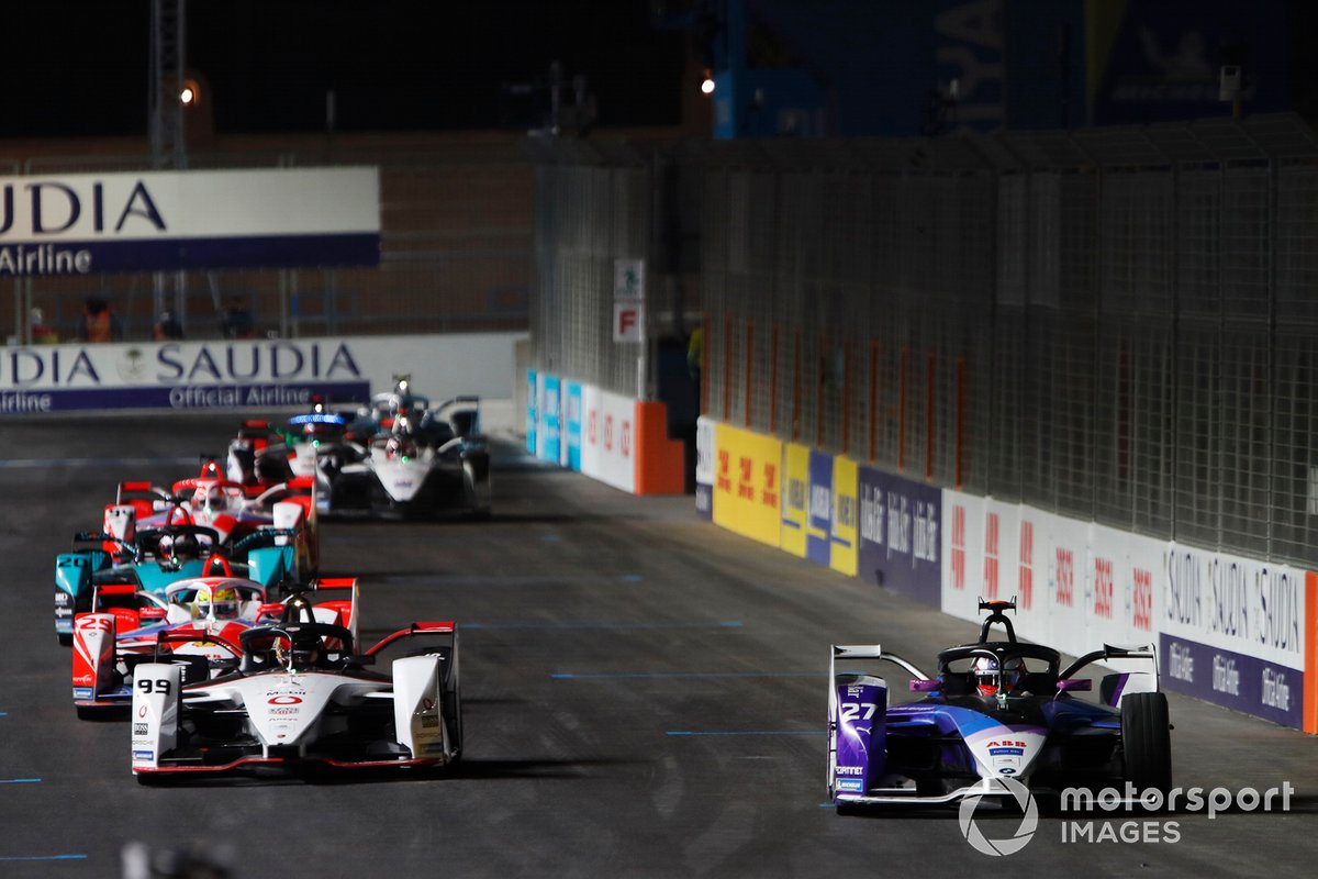 Jake Dennis, BMW I Andretti Motorsport, BMW iFE.21, leads Pascal Wehrlein, Tag Heuer Porsche, Porsche 99X Electric, Alexander Sims, Mahindra Racing, M7Electro, and Mitch Evans, Panasonic Jaguar Racing, Jaguar I-Type 5