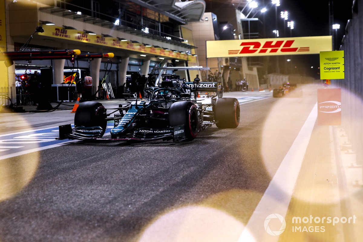 Lance Stroll, Aston Martin AMR21, in the pit lane