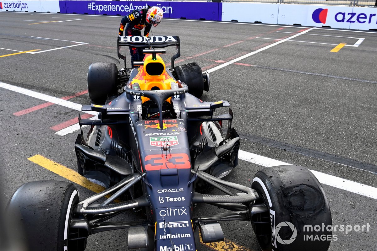 Max Verstappen, Red Bull Racing RB16B looking at the tyre after retiring from the race