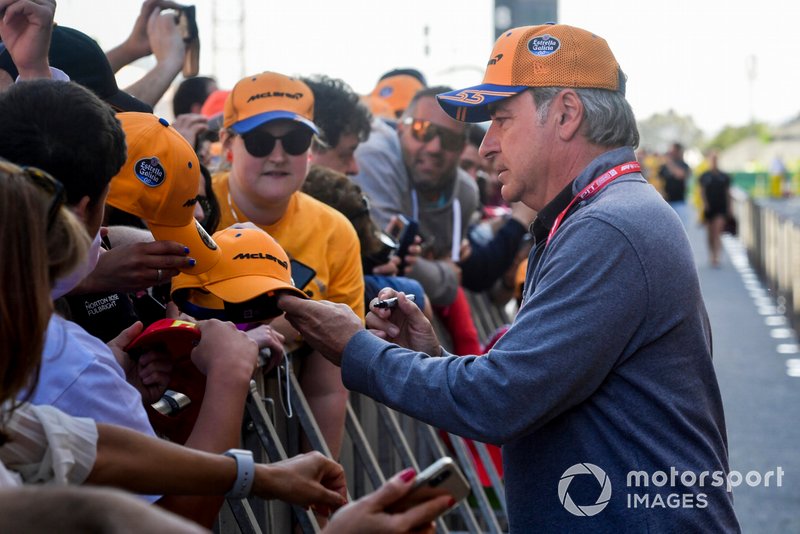 Carlos Sainz Sr signs autographs for fans 