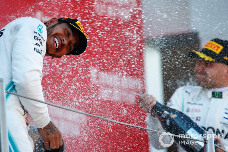 Lewis Hamilton, Mercedes AMG F1, 1st position, is blasted with Champagne by Valtteri Bottas, Mercedes AMG F1, 2nd position, on the podium