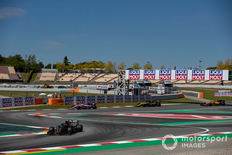 Kevin Magnussen, Haas F1 Team VF-19, leads Lance Stroll, Racing Point RP19, and Daniel Ricciardo, Renault R.S.19