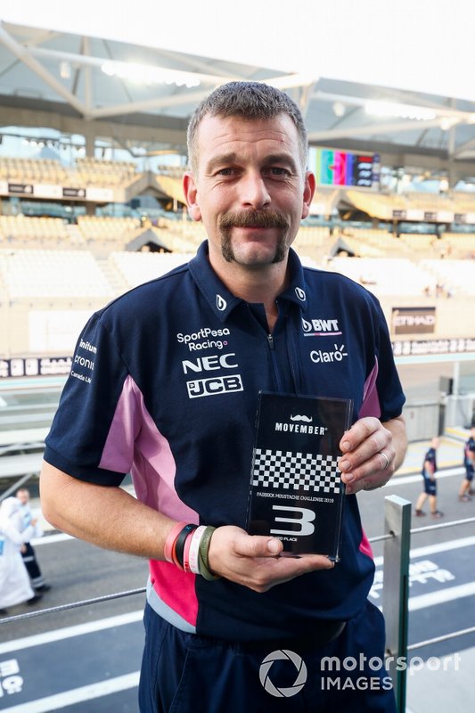 A Movember prize is awarded to a Racing Point team member